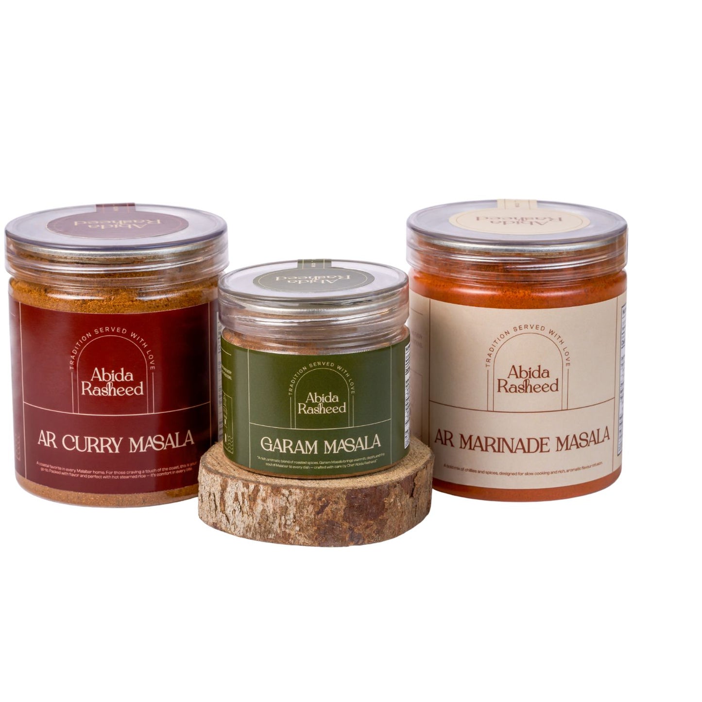 Three jars of Abida Rasheed spices on a white background