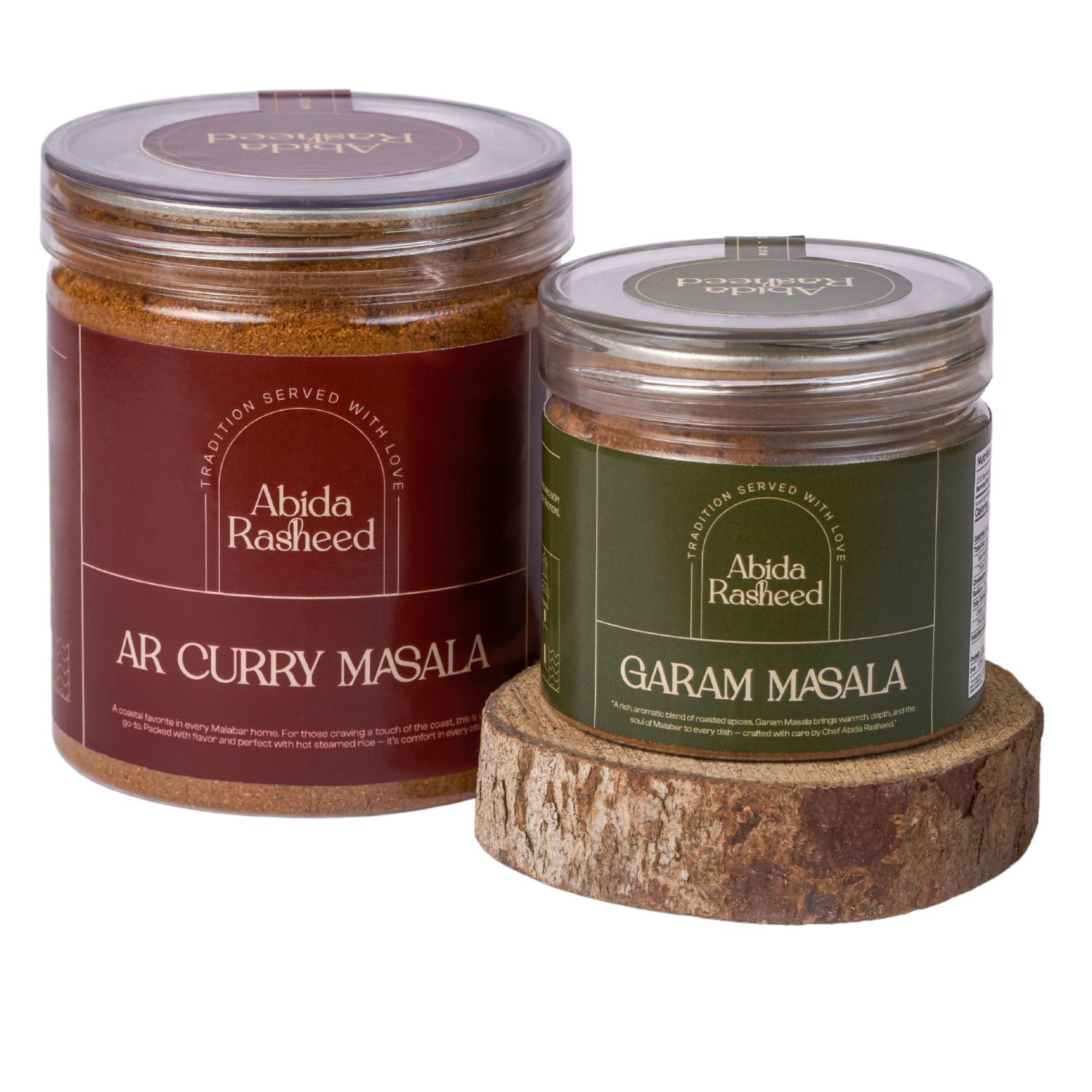 Two jars of Abida Rasheed curry and garam masala on a white background