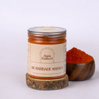 Jar of Abida Rasheed AR Marinade Masala with a wooden bowl of spices on a white background
