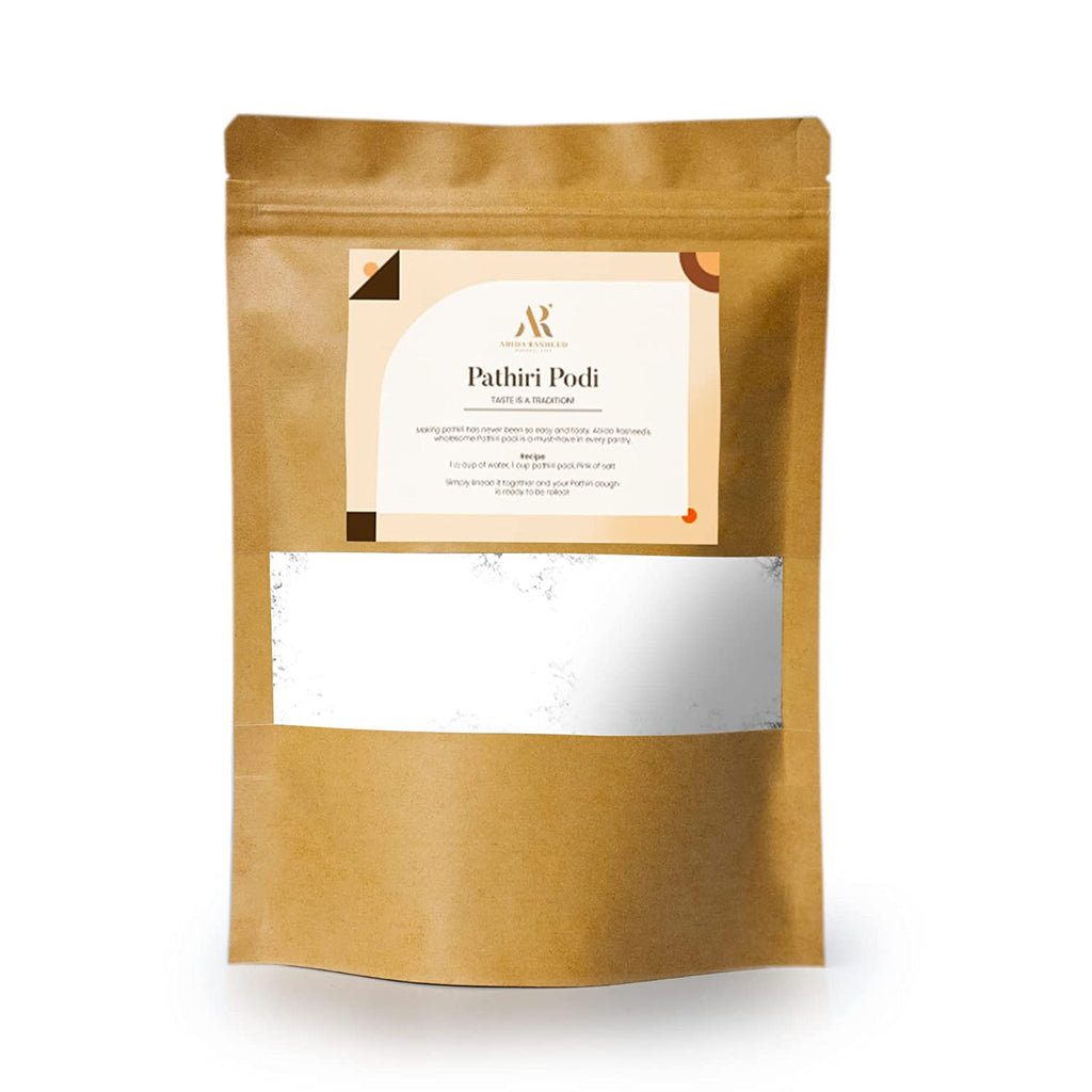 A standup pouch packaging of Abida Rasheed Rice Flour Pathiri Podi with a label showing the brand and product name.